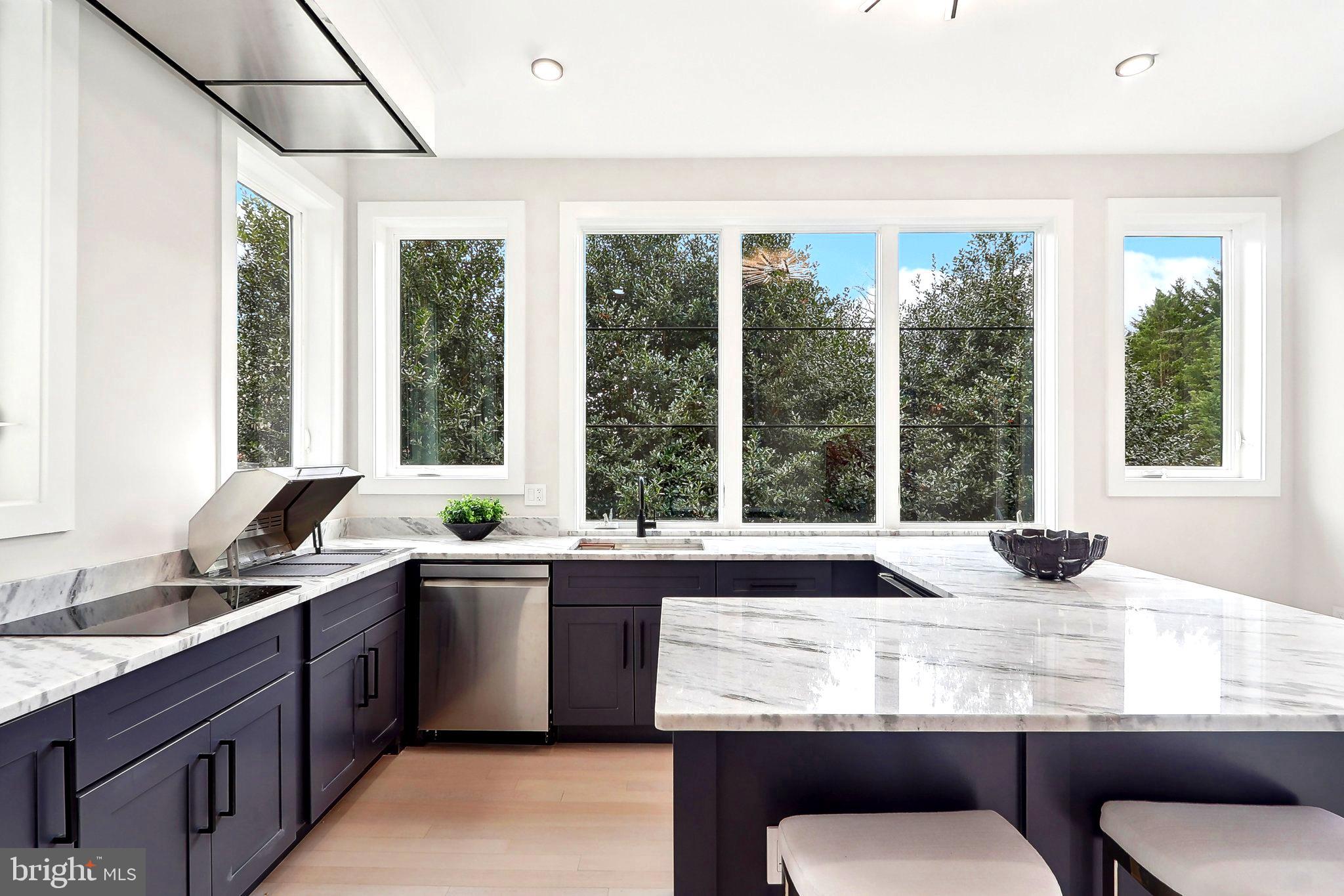 4920 Loughboro Road Northwest Washington, DC 20016 - Photo 9 of 41 a kitchen with a sink and large window