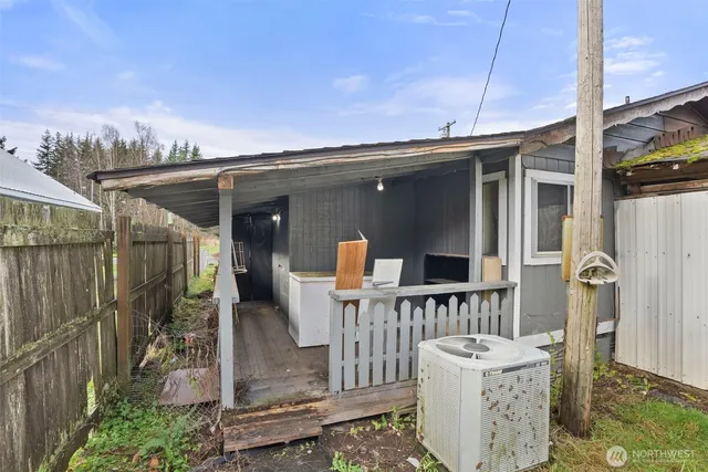 a view of a livingroom with furniture and a window