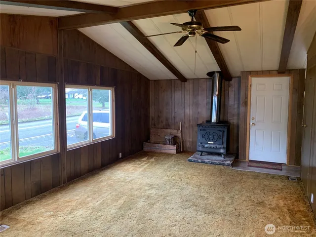 a kitchen with stainless steel appliances a sink cabinets and a window
