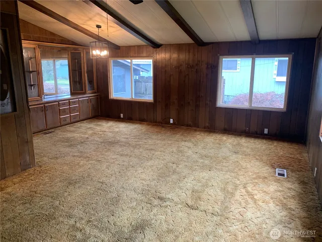a kitchen with stainless steel appliances granite countertop a refrigerator and a stove