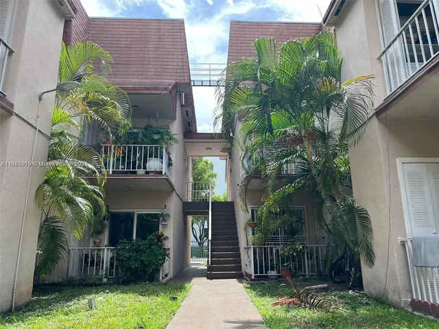 a view of a car park in front of house