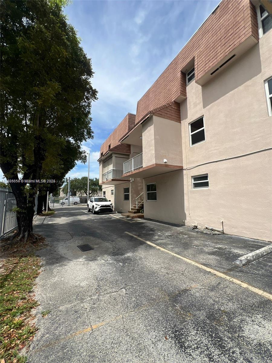 1560 West 46th Street, Unit 236 Hialeah, FL 33012 - Photo 16 of 19 a view of street with parked cars