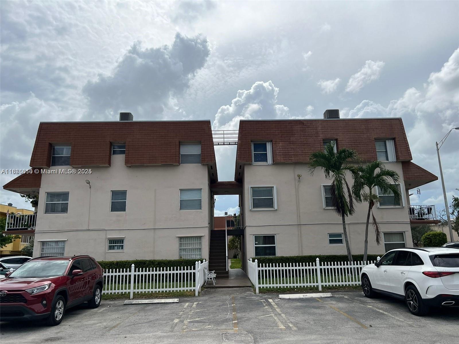 1560 West 46th Street, Unit 236 Hialeah, FL 33012 - Photo 18 of 19 a view of a car park in front of house