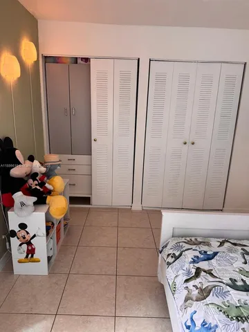 a view of a bathroom with a toilet and a shower curtain
