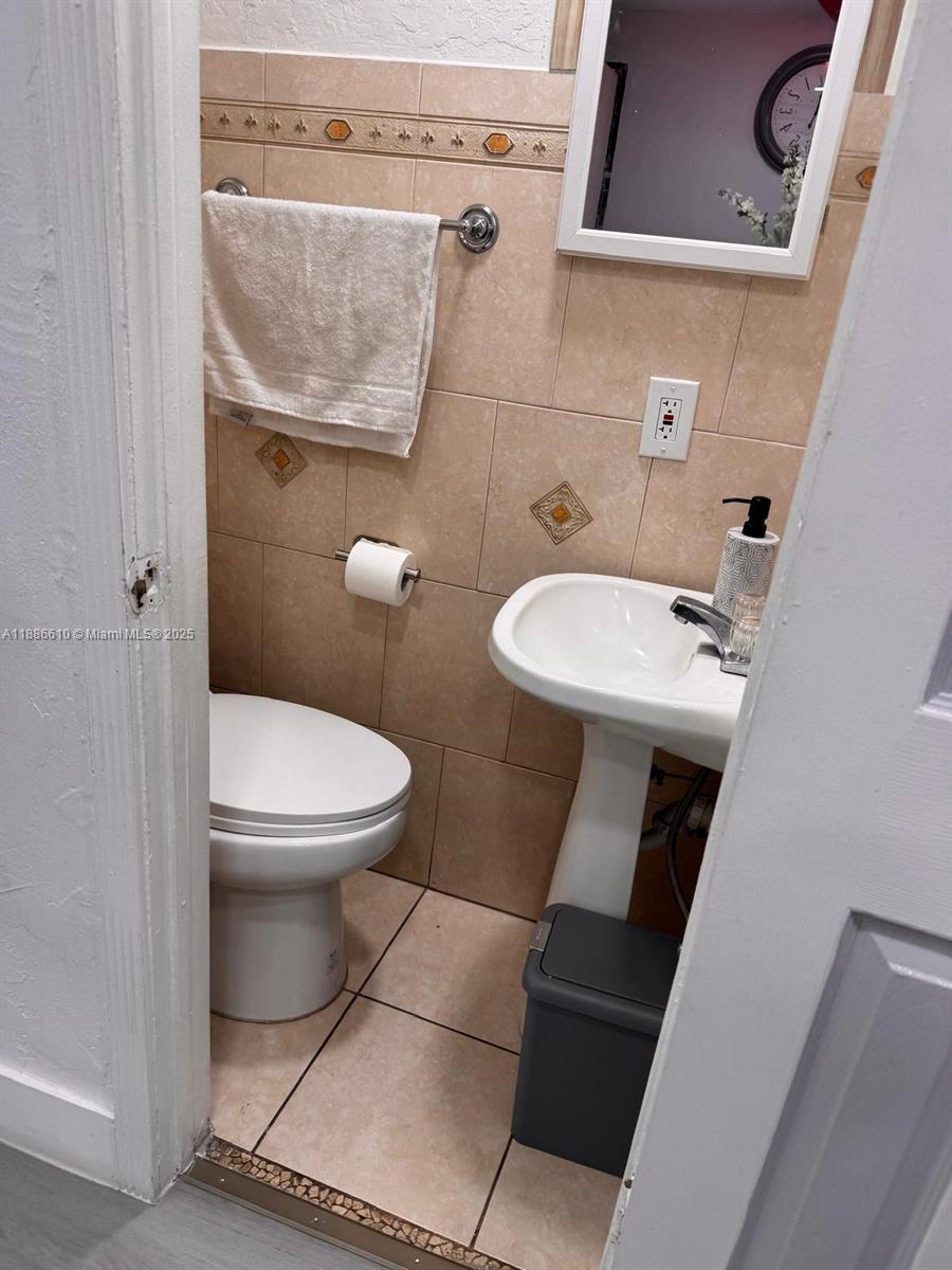 1560 West 46th Street, Unit 236 Hialeah, FL 33012 - Photo 8 of 19 a bathroom with a toilet and a sink