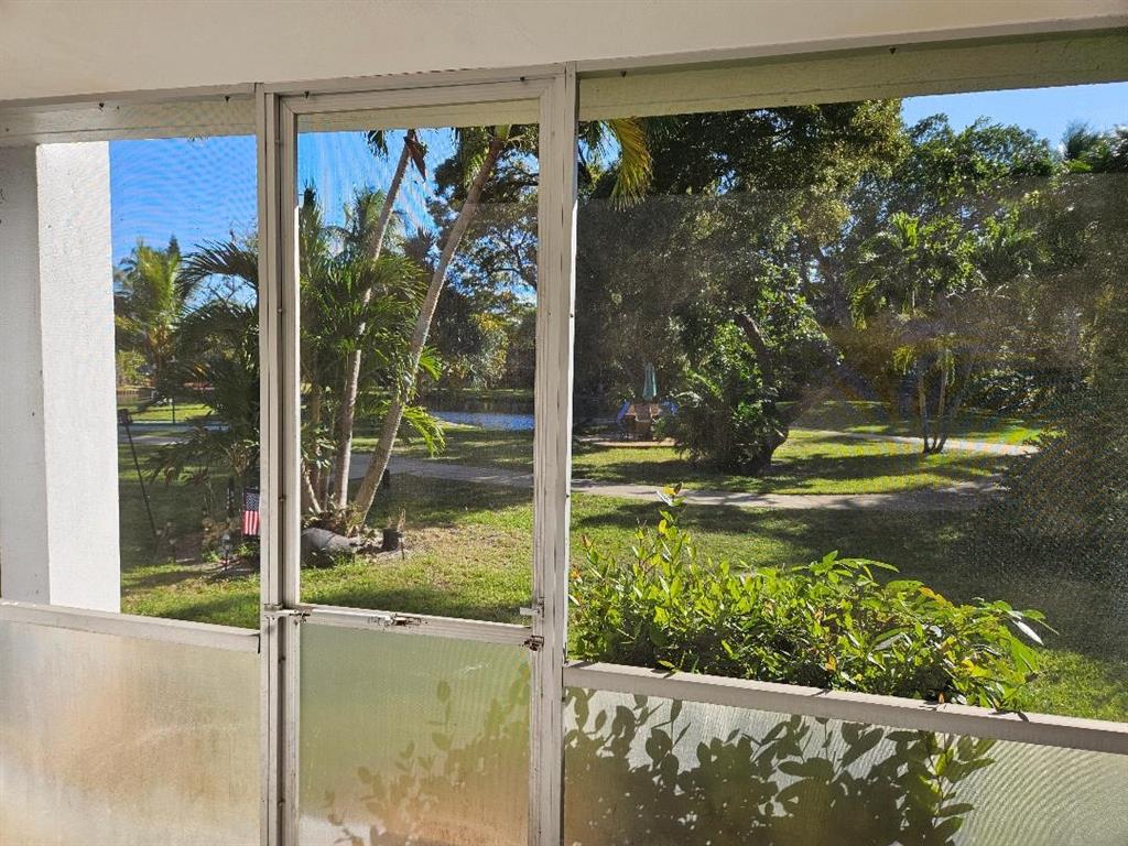 777 Southeast 2nd Avenue, Unit D123 Deerfield Beach, FL 33441 - Photo 2 of 36 a view of a porch