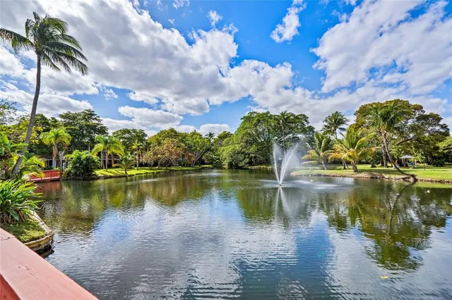 a view of a lake with a building in the background