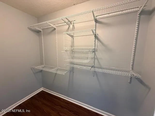 a view of a room with racks on the wall
