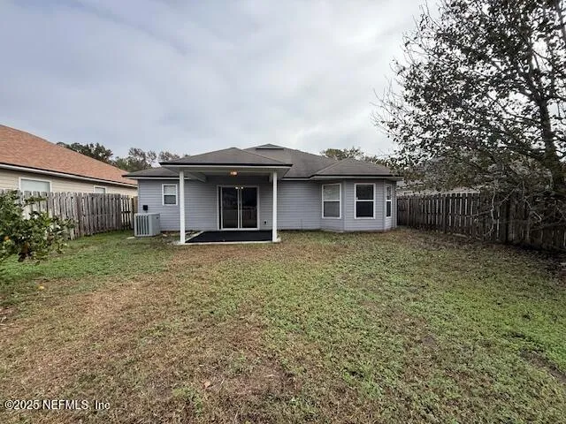 a view of a lake with houses in the back