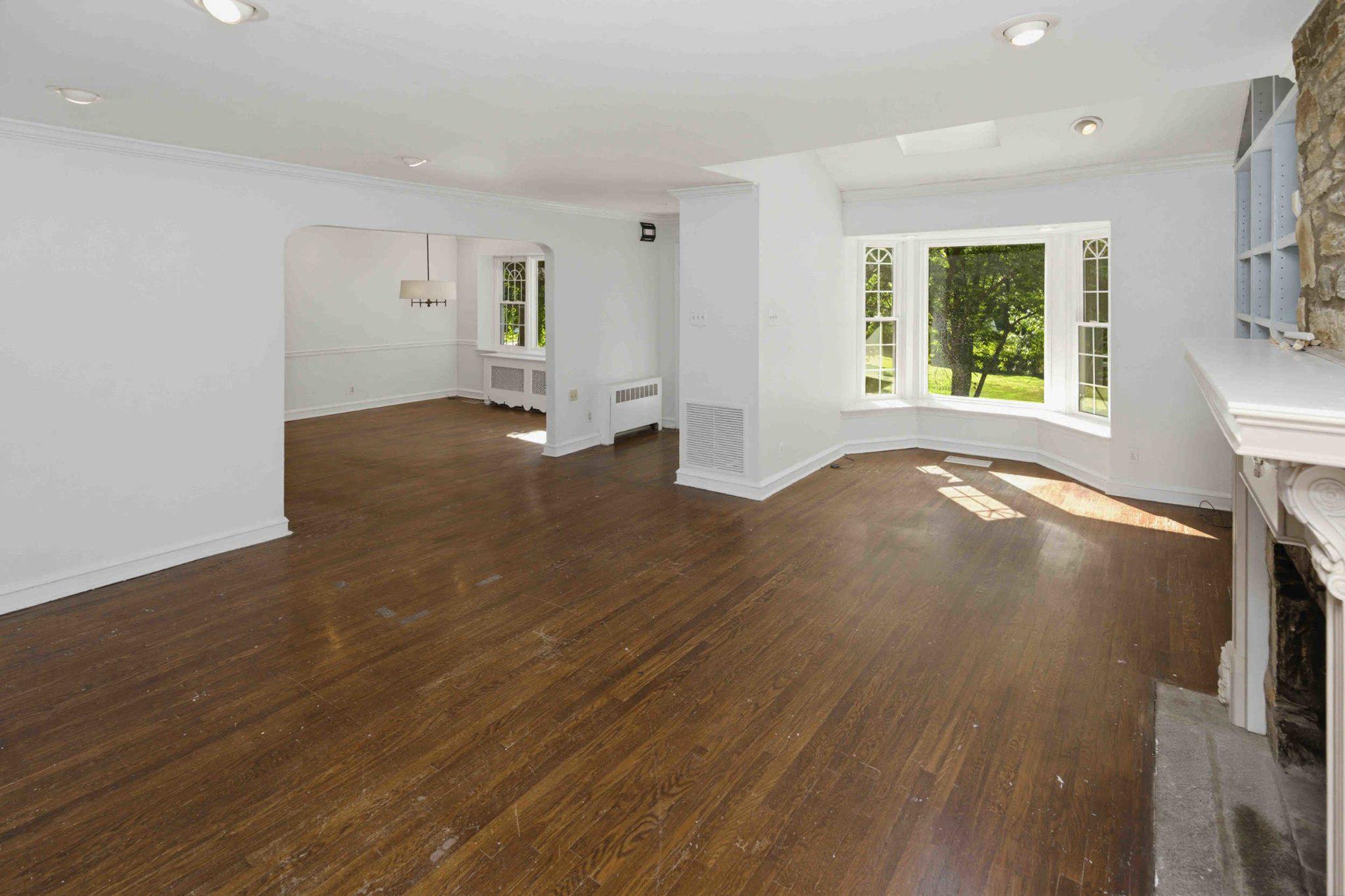 1268 Rydal Road Jenkintown, PA 19046 - Photo 19 of 31 an empty room with wooden floor and windows