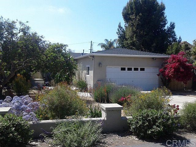 a view of a house with a garden
