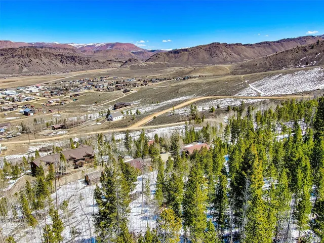 a view of a city with mountains in the background