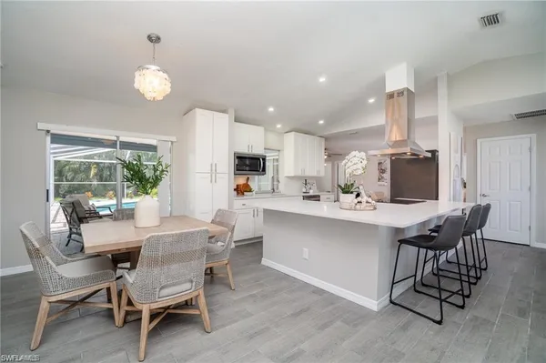 a dining room with furniture and window
