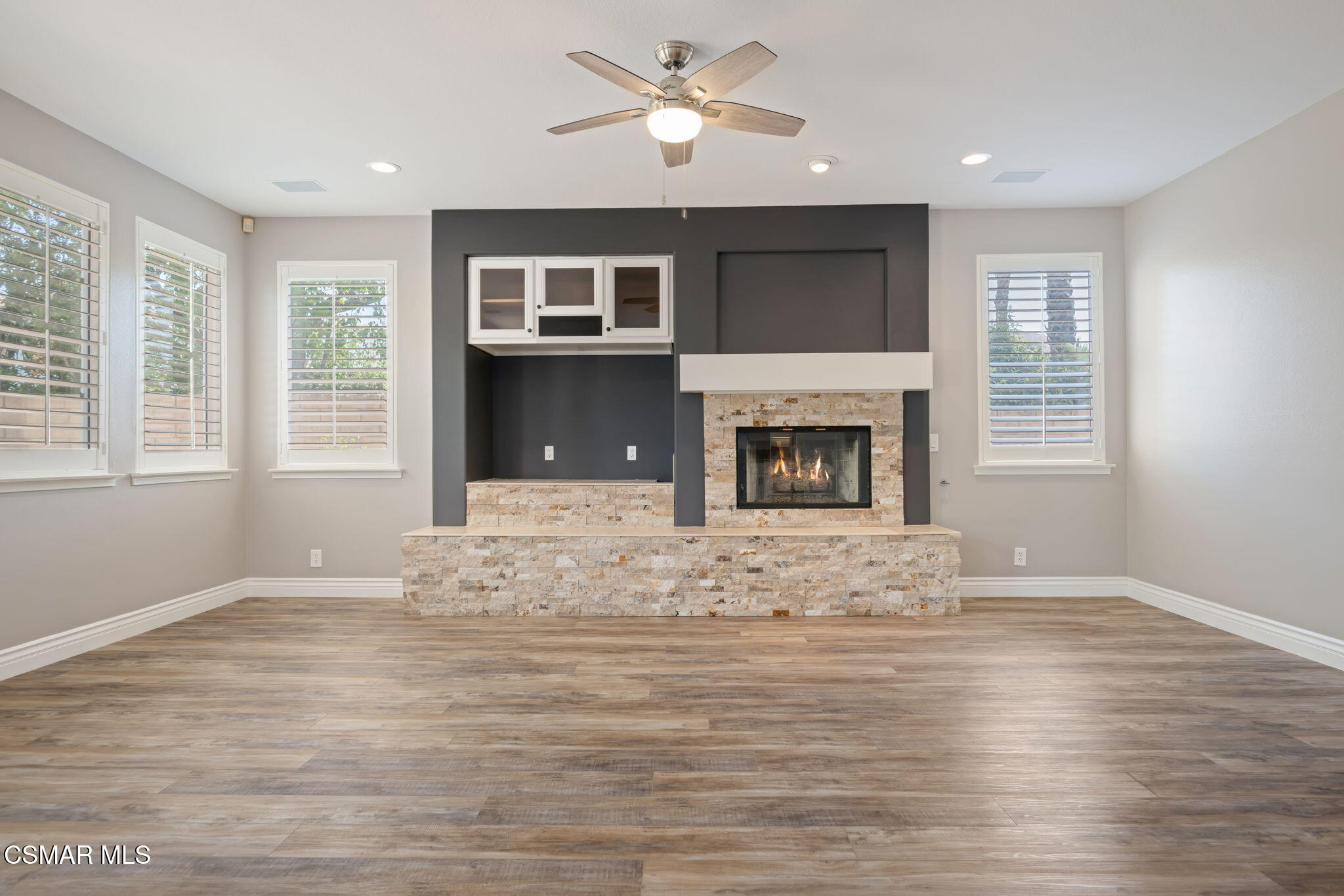 335 Kitetail Street Simi Valley, CA 93065 - Photo 11 of 53 a view of empty room with wooden floor and fireplace