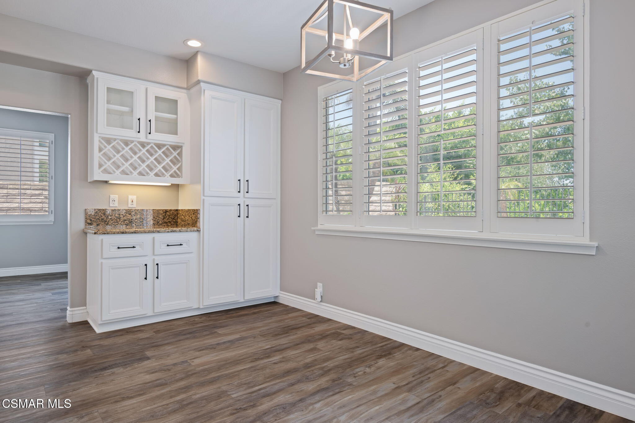 335 Kitetail Street Simi Valley, CA 93065 - Photo 19 of 53 a view of a kitchen with wooden floors and white walls