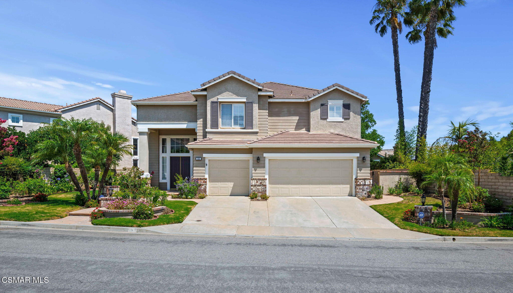 335 Kitetail Street Simi Valley, CA 93065 - Photo 2 of 53 a front view of a house with a yard and garage