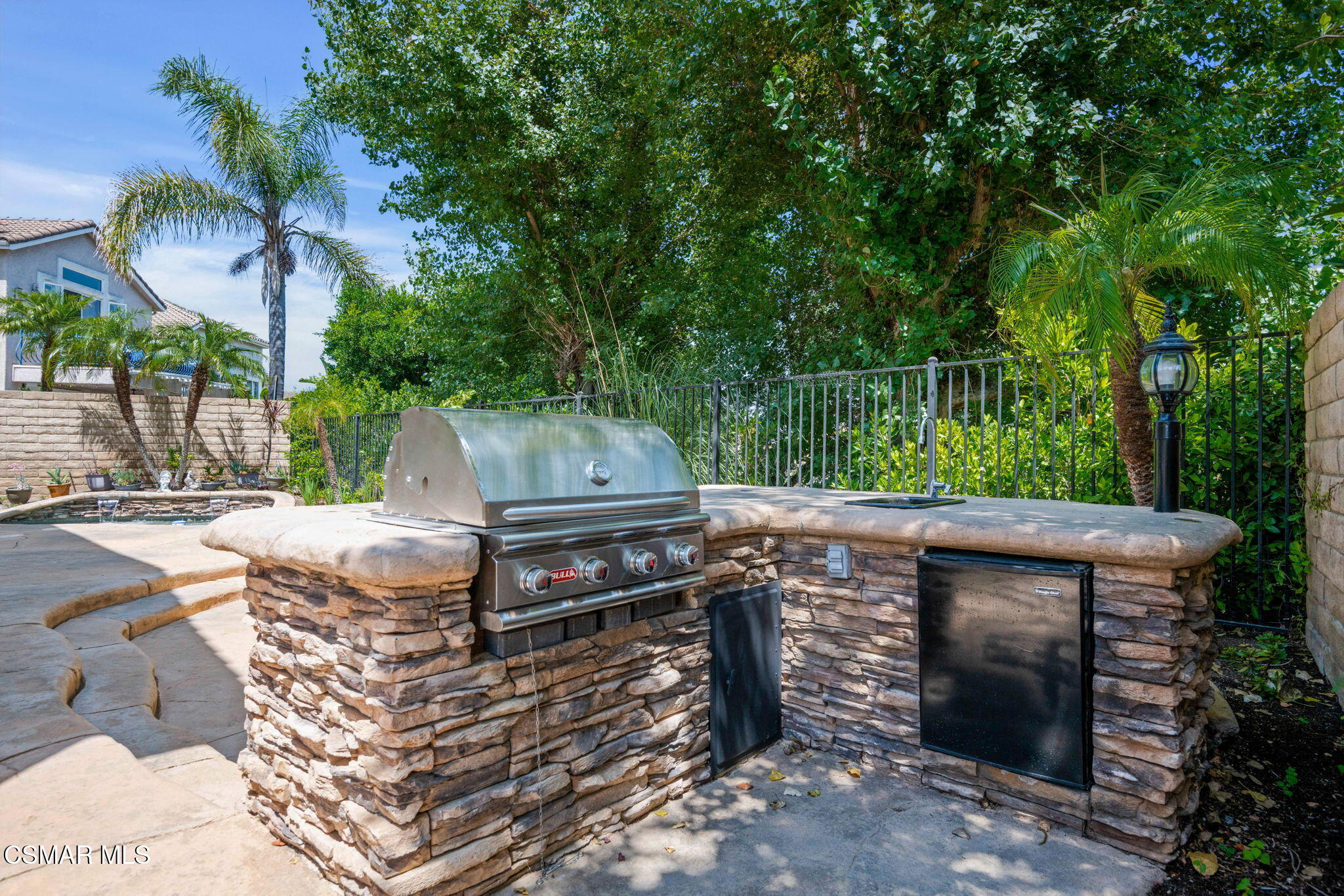 335 Kitetail Street Simi Valley, CA 93065 - Photo 25 of 53 a view of a backyard with sitting area