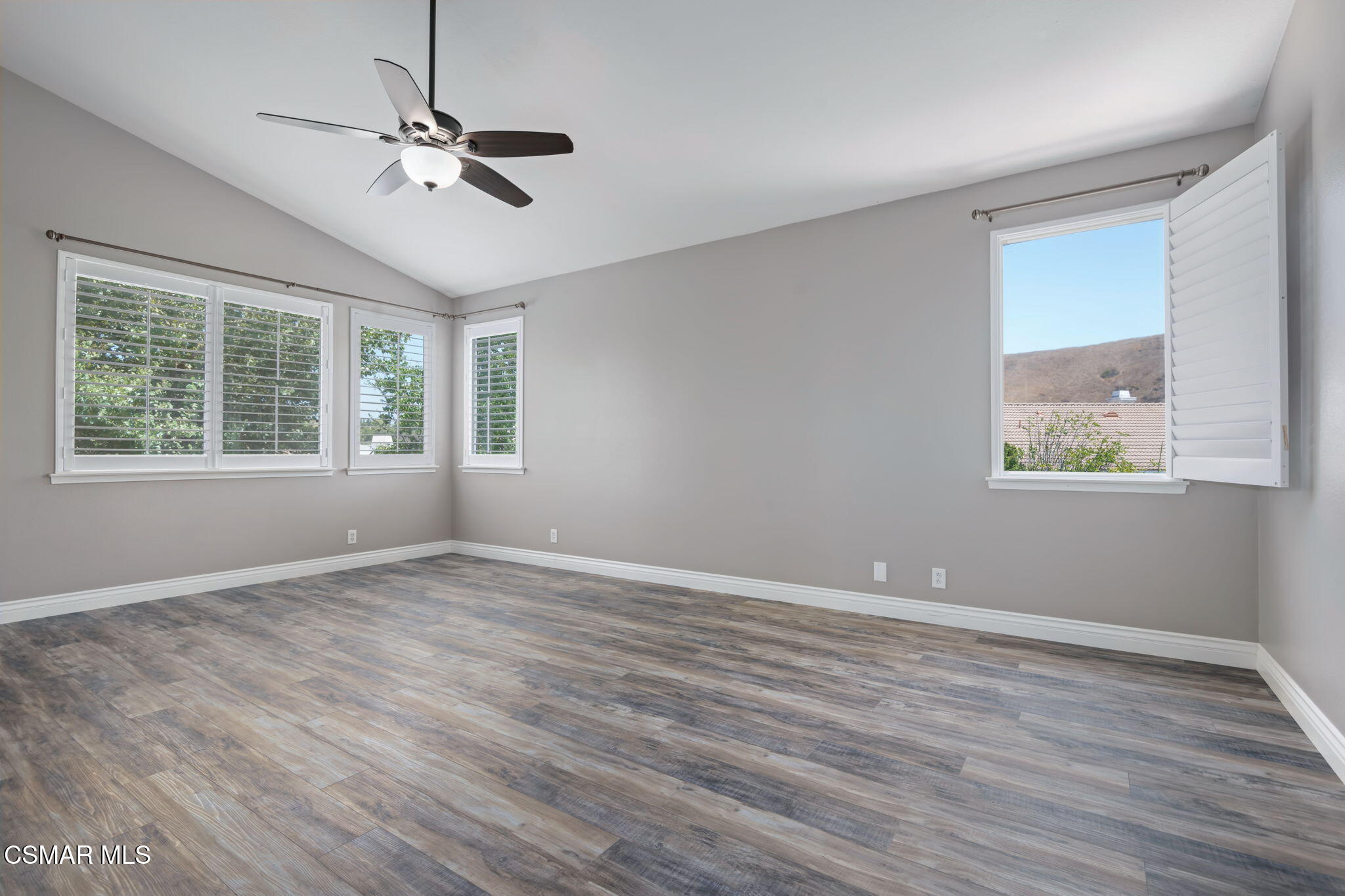 335 Kitetail Street Simi Valley, CA 93065 - Photo 27 of 53 a view of an empty room with wooden floor and a window
