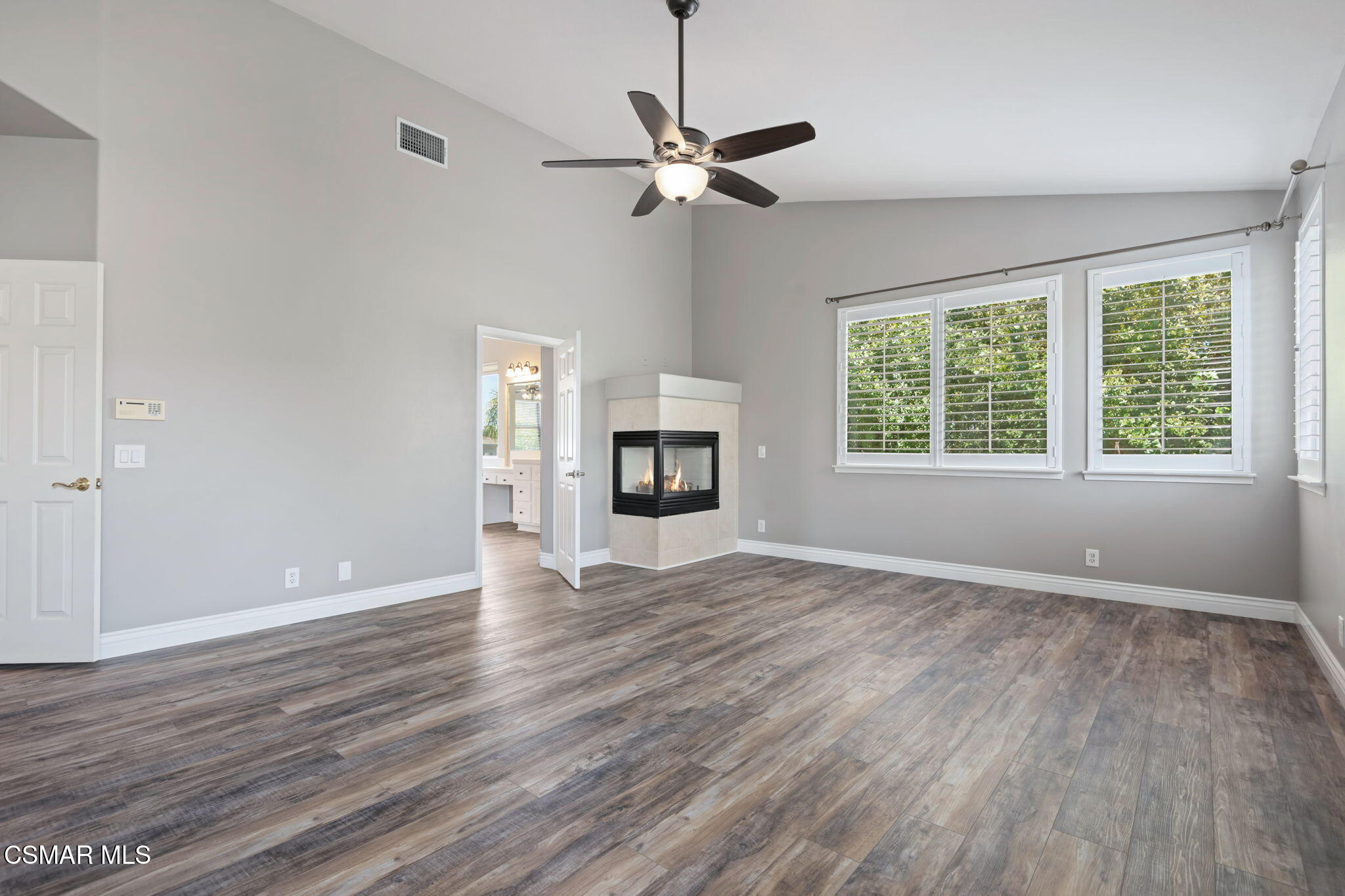335 Kitetail Street Simi Valley, CA 93065 - Photo 28 of 53 a view of an empty room with wooden floor and a window