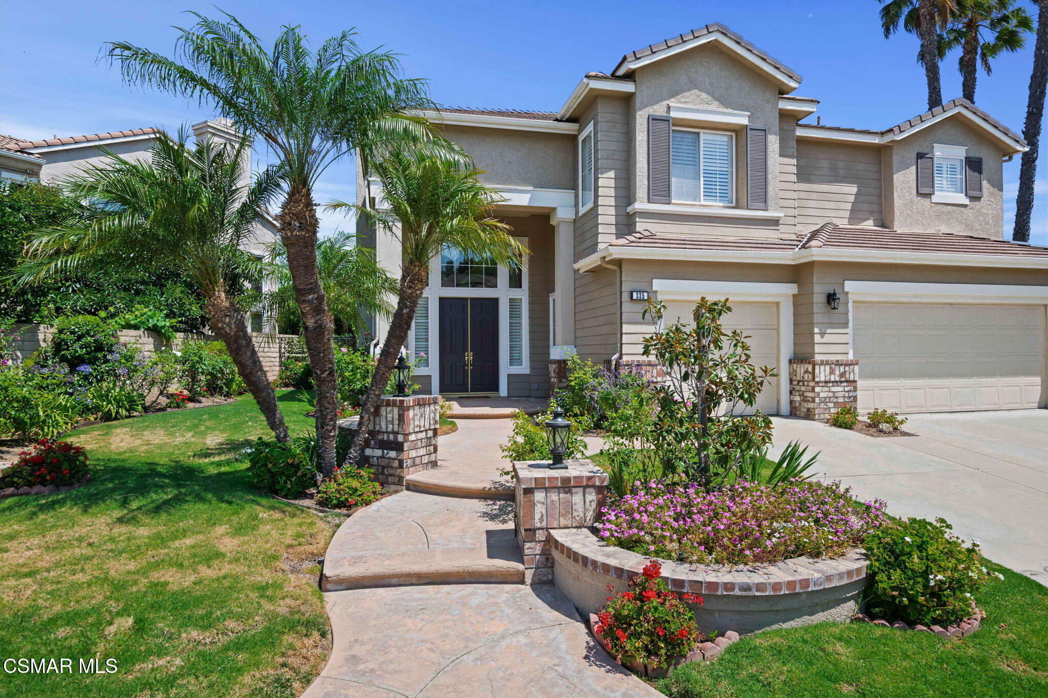 335 Kitetail Street Simi Valley, CA 93065 - Photo 3 of 53 a front view of a house with a yard