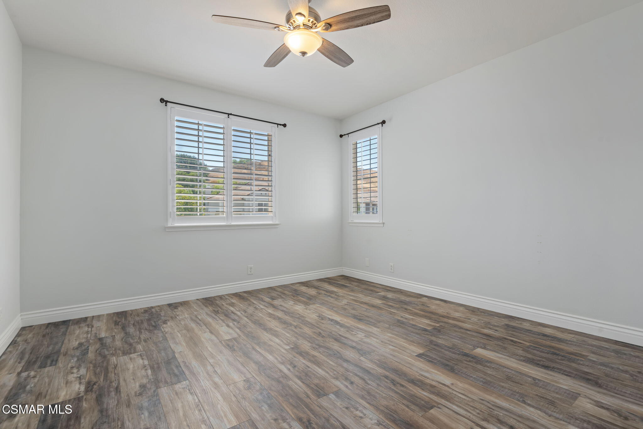 335 Kitetail Street Simi Valley, CA 93065 - Photo 36 of 53 a view of an empty room with wooden floor and a window