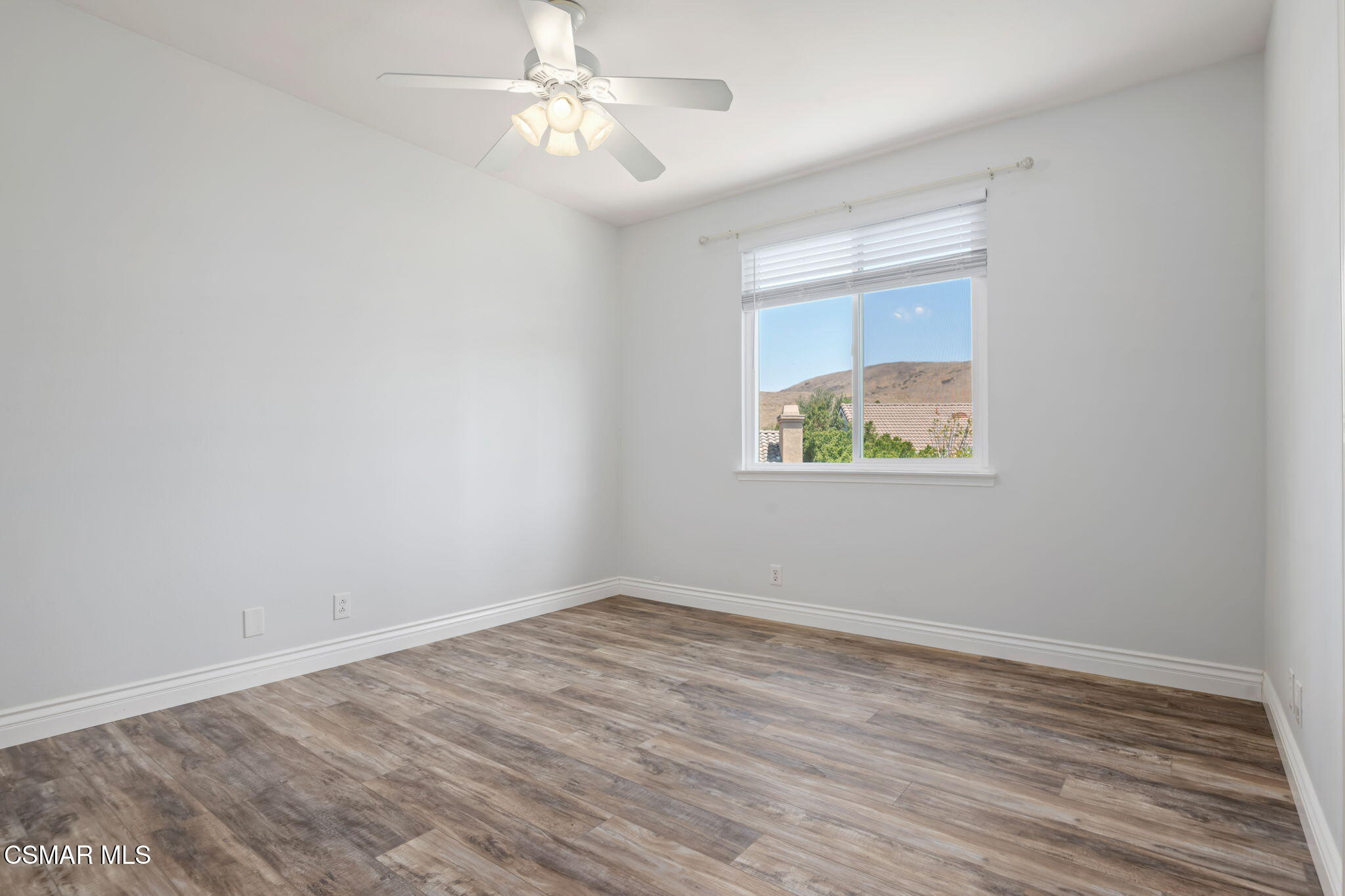 335 Kitetail Street Simi Valley, CA 93065 - Photo 38 of 53 wooden floor in an empty room with a window