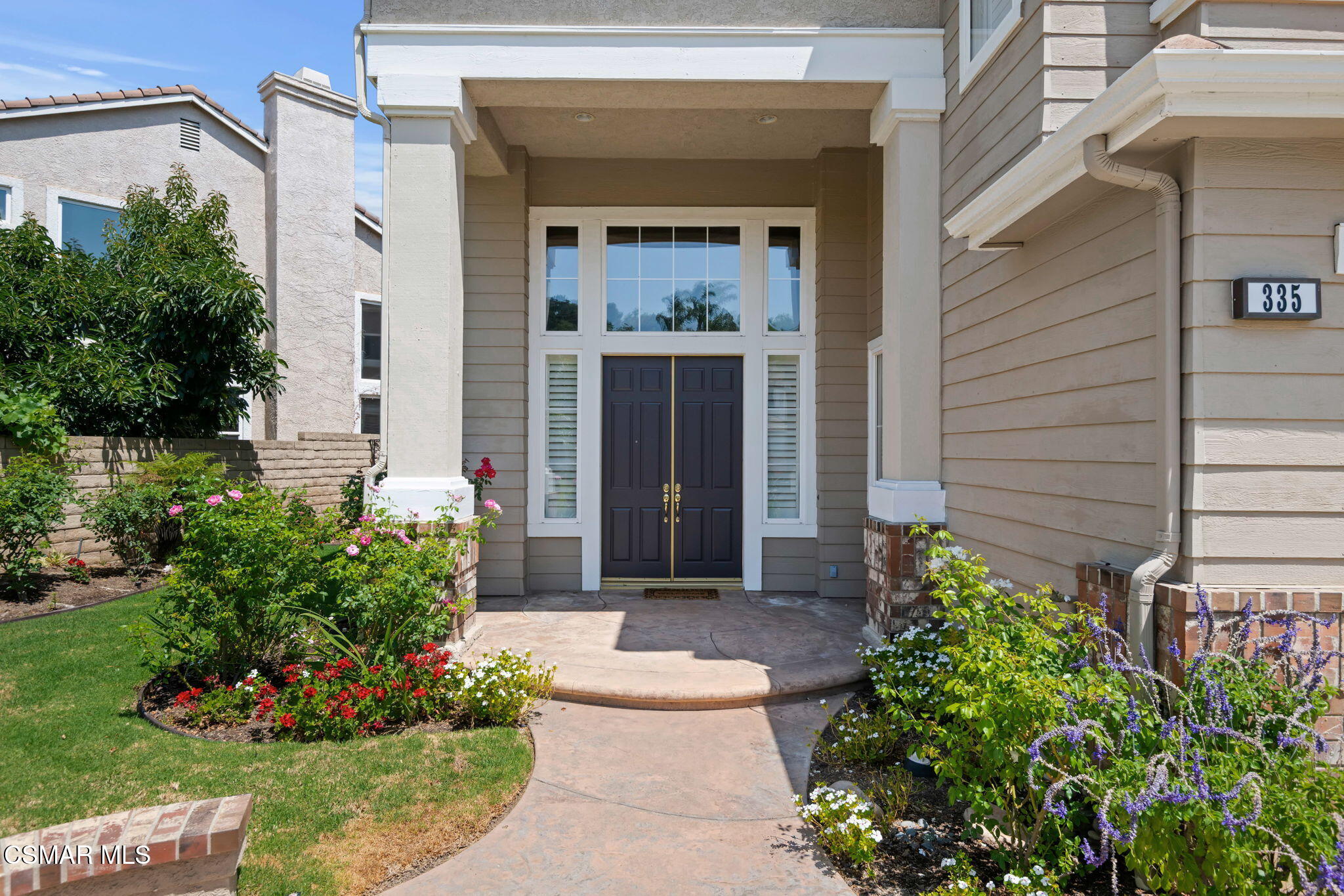 335 Kitetail Street Simi Valley, CA 93065 - Photo 4 of 53 a front view of a house with a garden