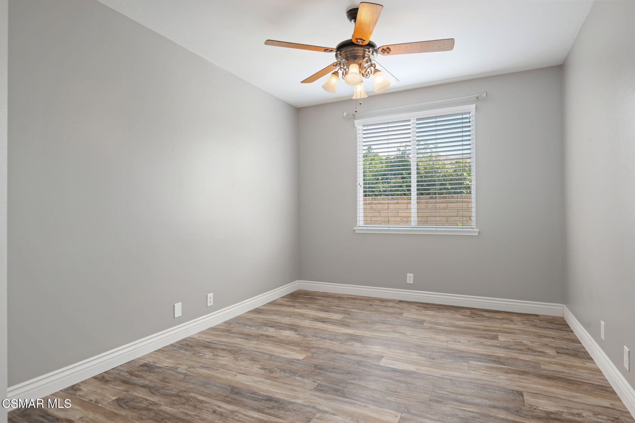 335 Kitetail Street Simi Valley, CA 93065 - Photo 42 of 53 a view of an empty room with wooden floor and a window