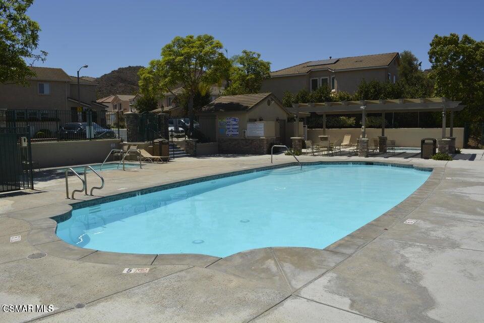 335 Kitetail Street Simi Valley, CA 93065 - Photo 46 of 53 a view of a swimming pool with sitting area