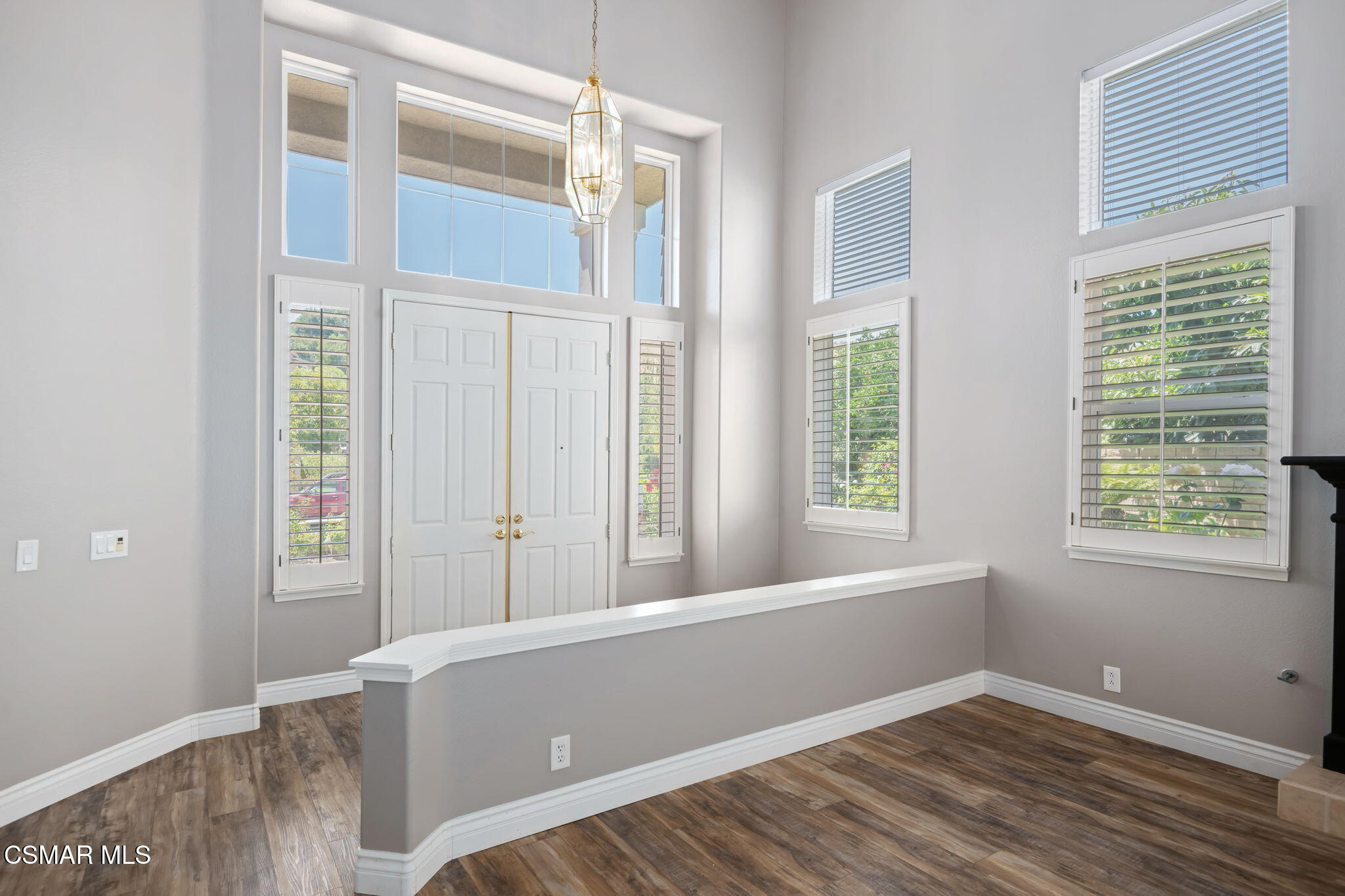 335 Kitetail Street Simi Valley, CA 93065 - Photo 5 of 53 a view of an empty room with wooden floor and a window