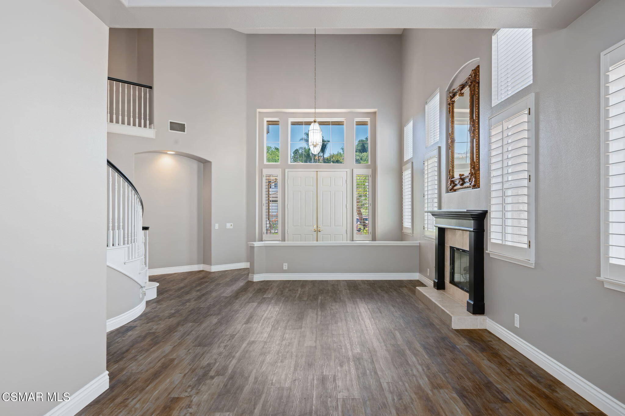 335 Kitetail Street Simi Valley, CA 93065 - Photo 9 of 53 an empty room with wooden floor and windows