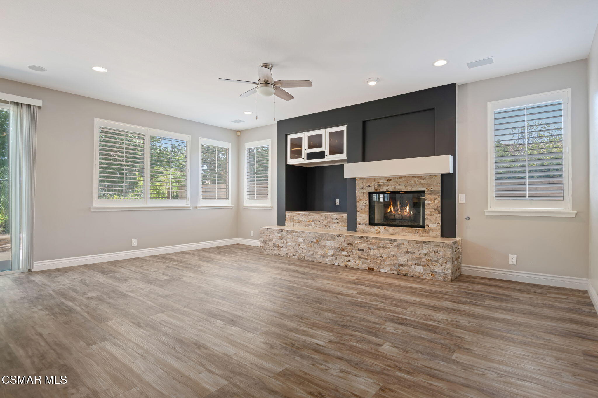 335 Kitetail Street Simi Valley, CA 93065 - Photo 10 of 53 a view of an empty room with a fireplace and a window