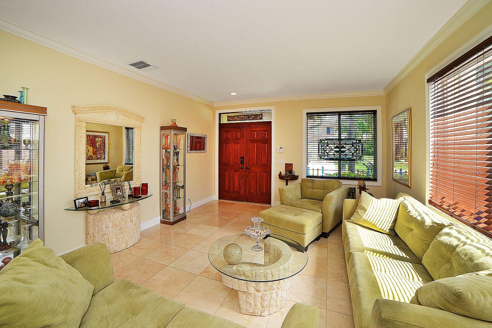 11140 Sandpoint Terrace Boca Raton, FL 33428 - Photo 3 of 32 a living room with furniture and a large window