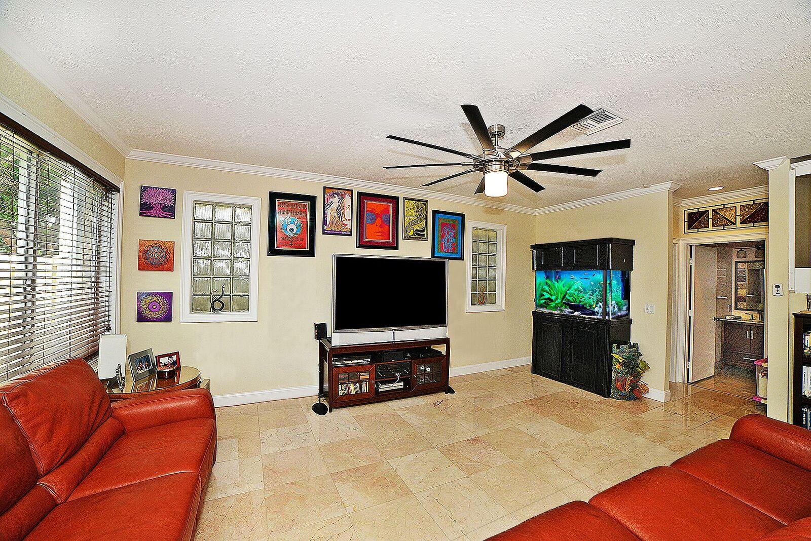 11140 Sandpoint Terrace Boca Raton, FL 33428 - Photo 8 of 32 a living room with furniture and a flat screen tv
