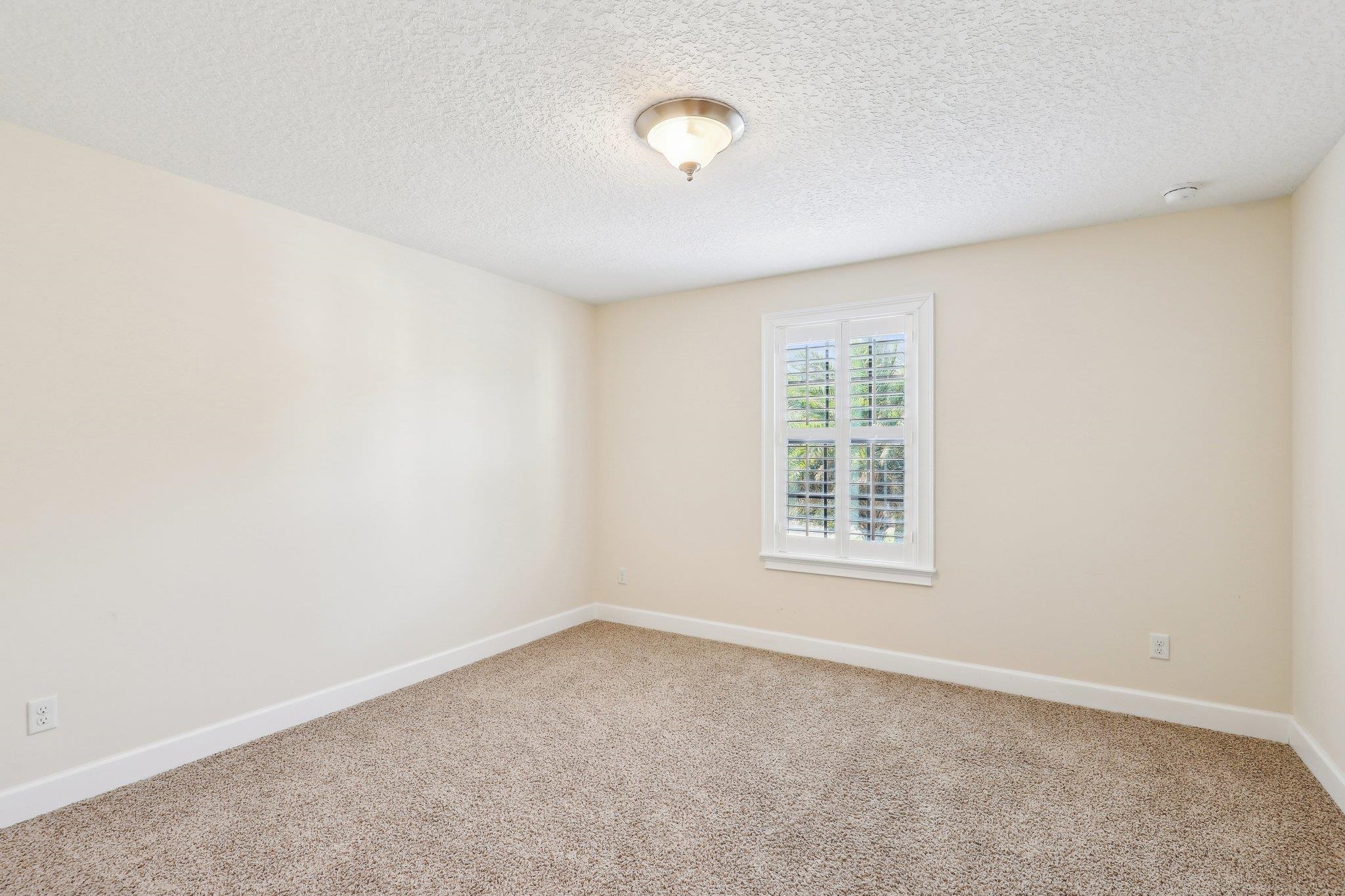 152 Spanish Marsh Drive St. Augustine, FL 32095 - Photo 33 of 63 an empty room with windows