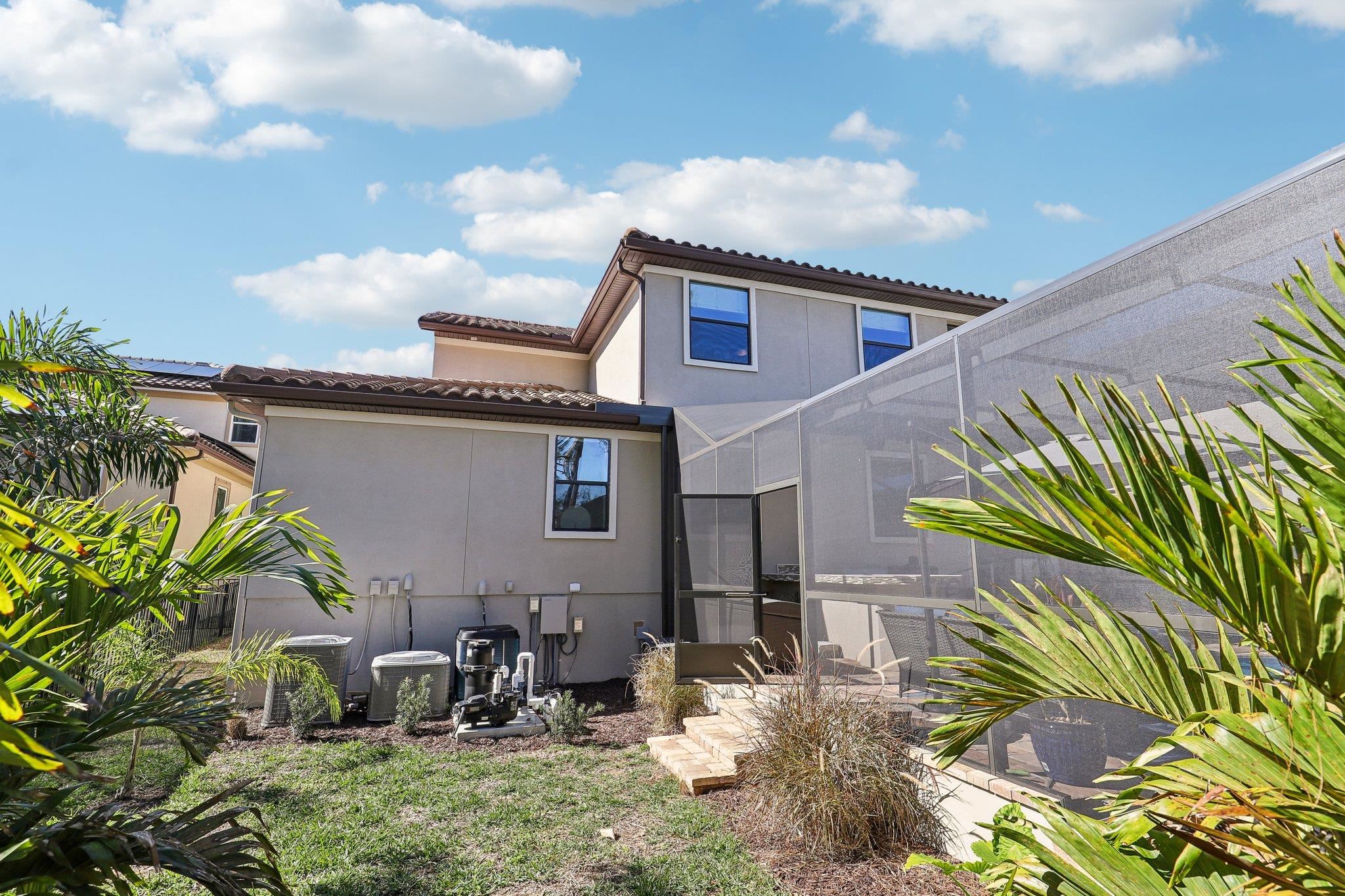 152 Spanish Marsh Drive St. Augustine, FL 32095 - Photo 36 of 63 a backyard of a house with table and chairs