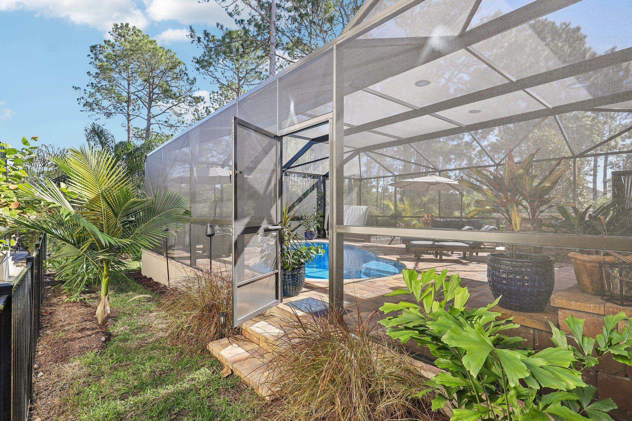 152 Spanish Marsh Drive St. Augustine, FL 32095 - Photo 61 of 63 a view of a swimming pool with a patio