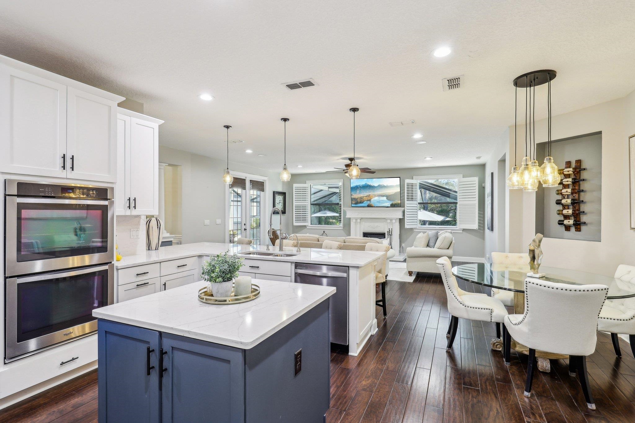 152 Spanish Marsh Drive St. Augustine, FL 32095 - Photo 7 of 63 a room with stainless steel appliances kitchen island granite countertop a table chairs and a stove