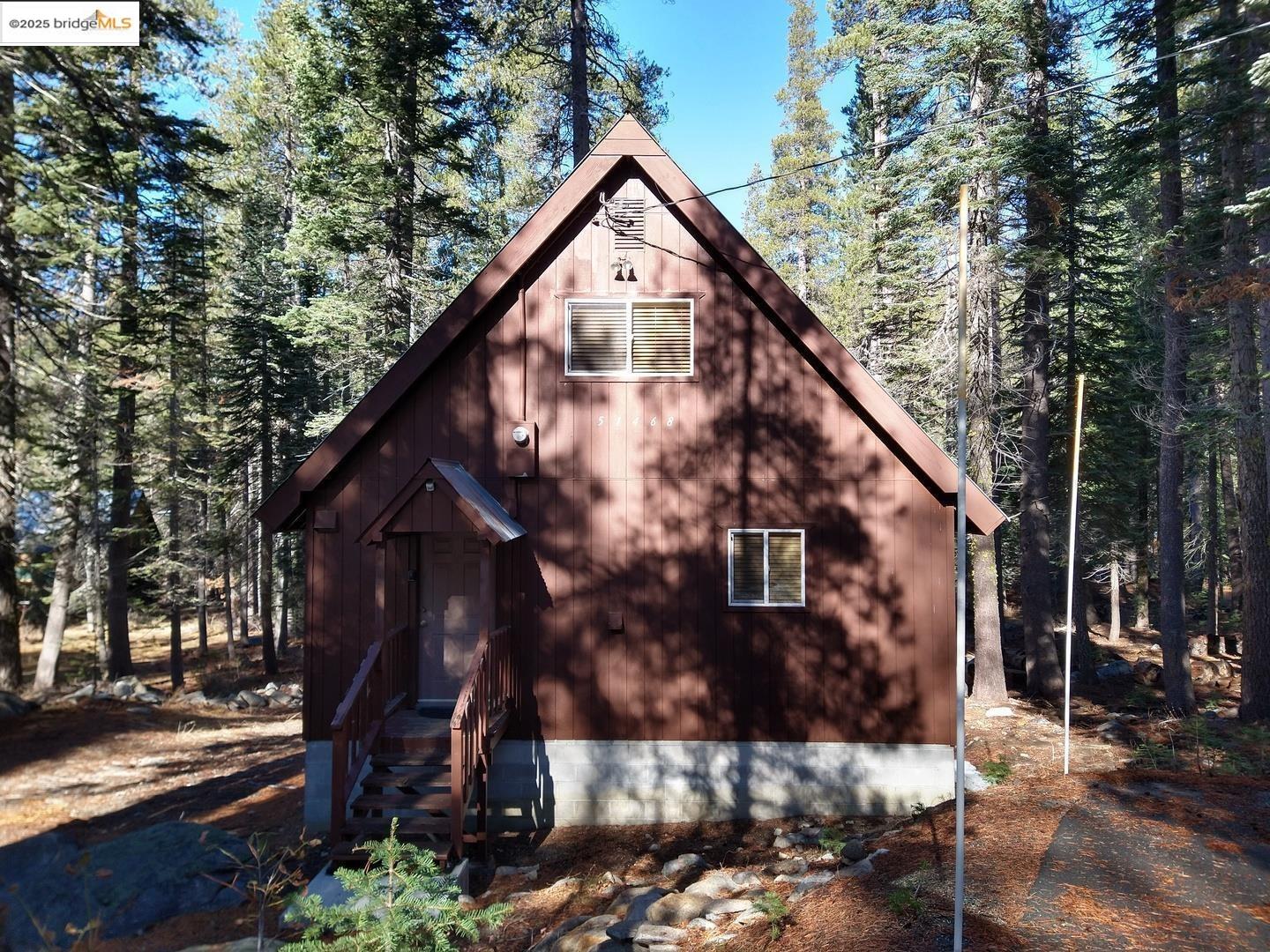 51468 Donner Pass Road Soda Springs, CA 95728 - Photo 1 of 22 a view of a house with a yard
