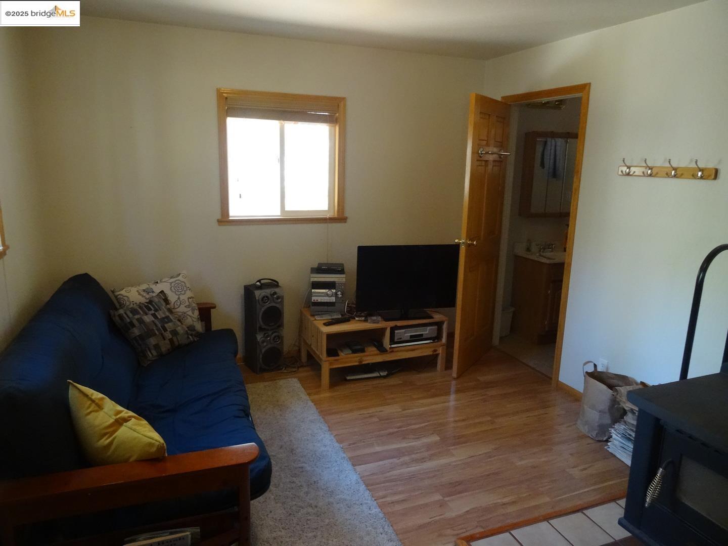 51468 Donner Pass Road Soda Springs, CA 95728 - Photo 14 of 22 a living room with furniture and a flat screen tv