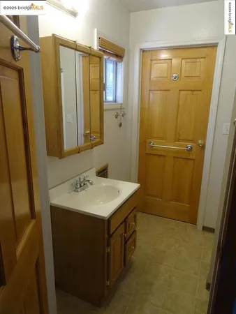 a bathroom with a sink a mirror and a shower
