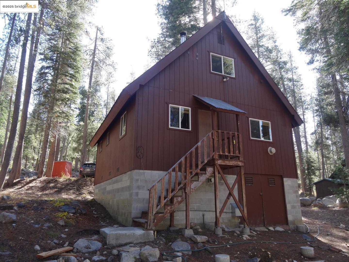 51468 Donner Pass Road Soda Springs, CA 95728 - Photo 3 of 22 a view of a house with a yard