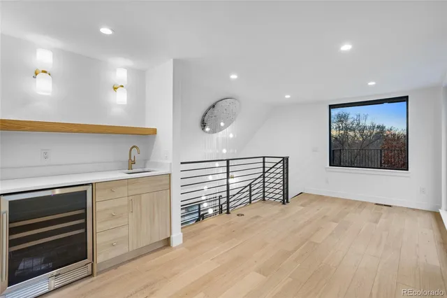 a view of a room with wooden floor and window