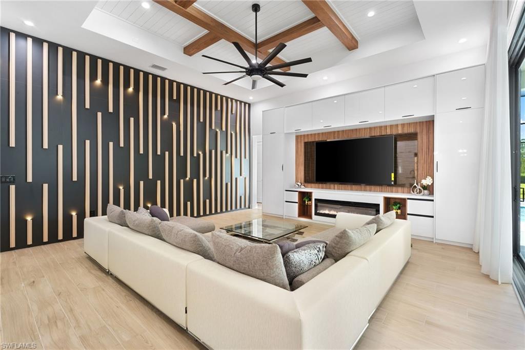 7040 Sable Ridge Lane Naples, FL 34109 - Photo 18 of 50 Dual living areas each feature electric fireplaces