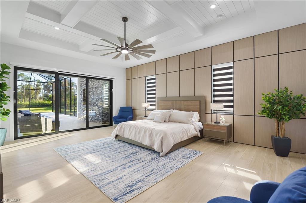 7040 Sable Ridge Lane Naples, FL 34109 - Photo 26 of 50 Light and bright primary suite offers direct access to the pool deck