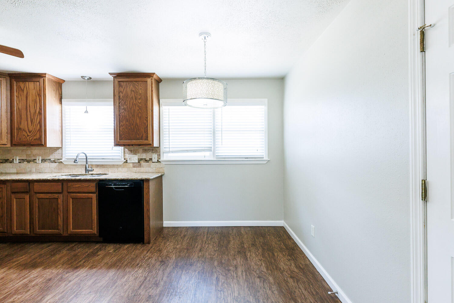 4816 45th Street Lubbock, TX 79414 - Photo 11 of 36 a bathroom with a sink and a mirror