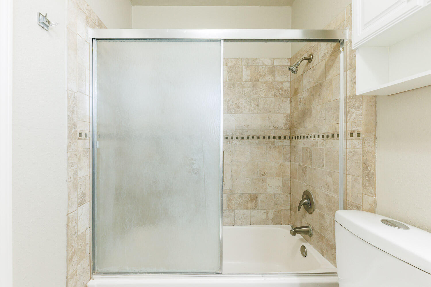 4816 45th Street Lubbock, TX 79414 - Photo 28 of 36 a bathroom with a bathtub and a shower