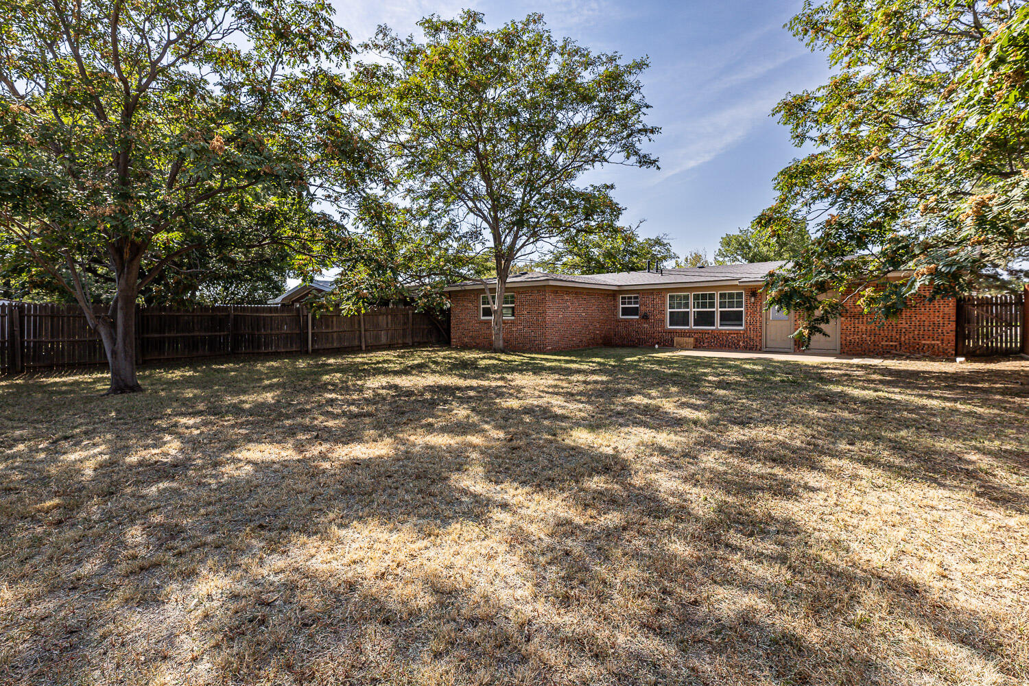 4816 45th Street Lubbock, TX 79414 - Photo 34 of 36 a view of a house with a yard