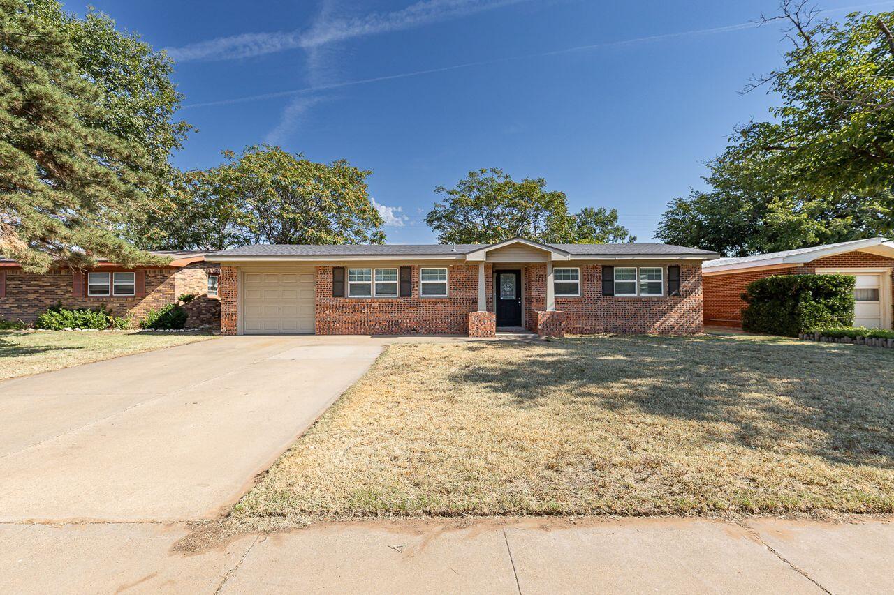 4816 45th Street Lubbock, TX 79414 - Photo 36 of 36 front view of a house with a yard