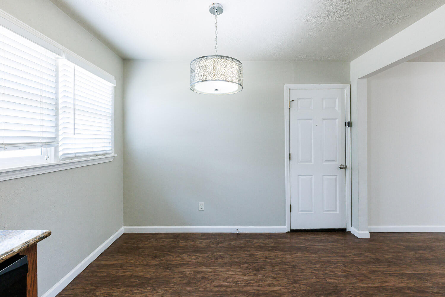 4816 45th Street Lubbock, TX 79414 - Photo 10 of 36 wooden floor in an empty room with a window
